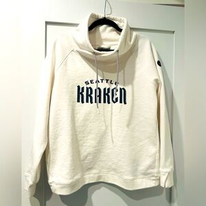 Women’s Large Kraken Sweatshirt from the pro shop with cute back.